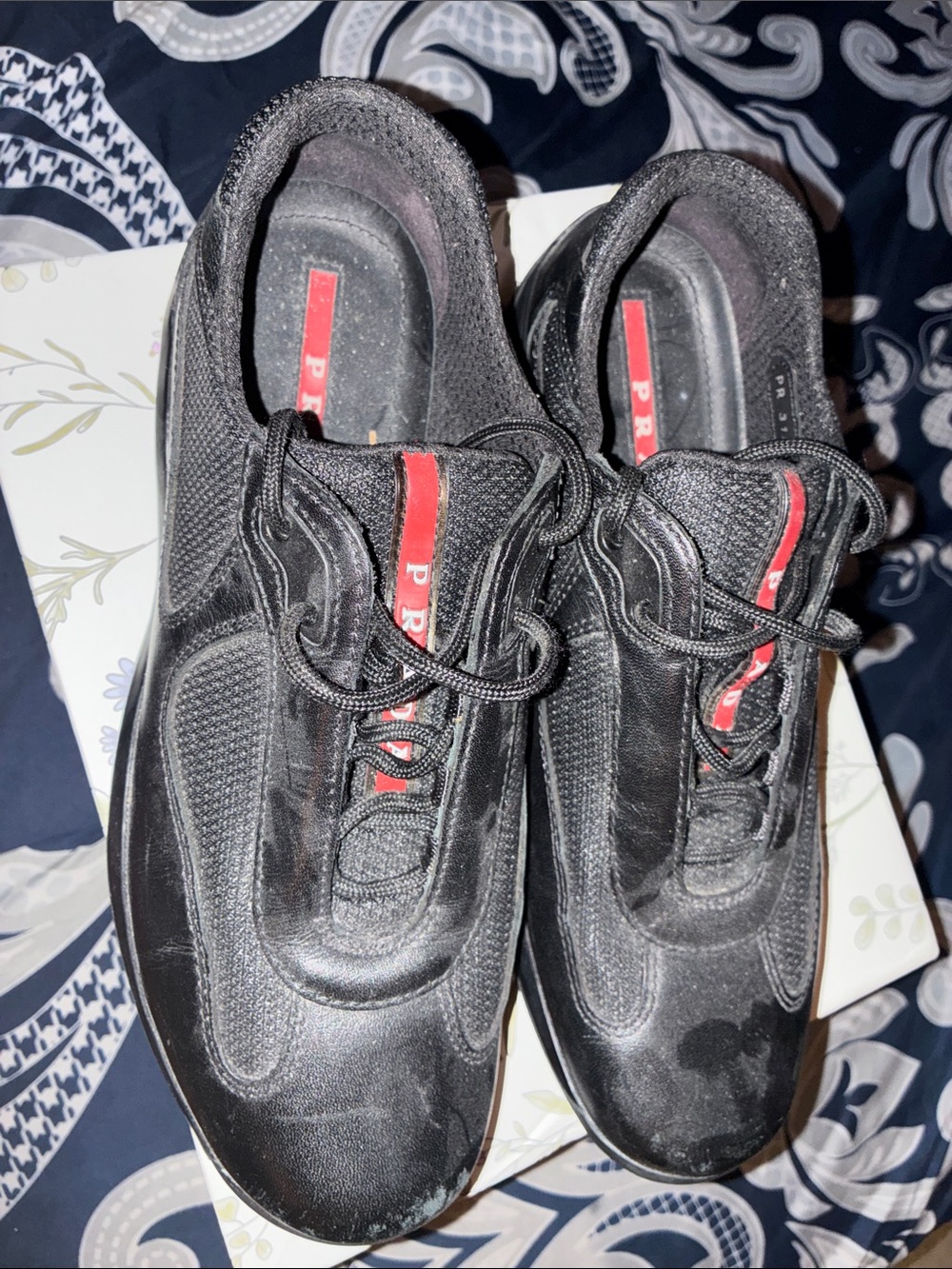 Prada Black Sneakers with Red Logo Stripe